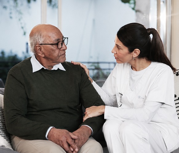 Caretaker speaking with person